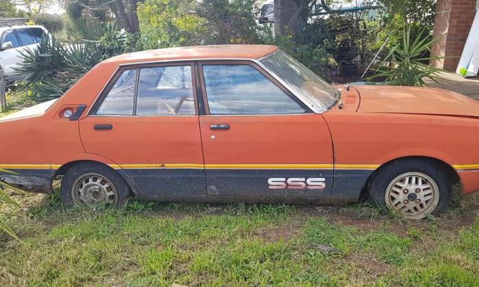 1981 Datsun Stanza SSS sedan red on black 2021 parts car wreck (1).jpg