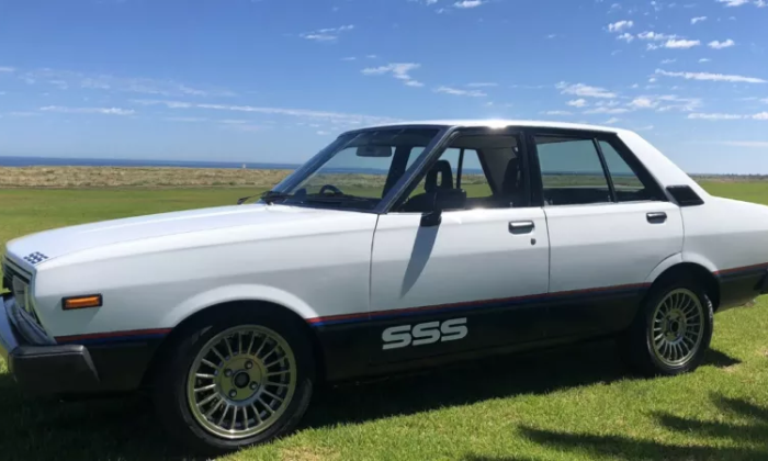 Datsun Stanza SSS Sedan white on black Australia 2021 (2).png