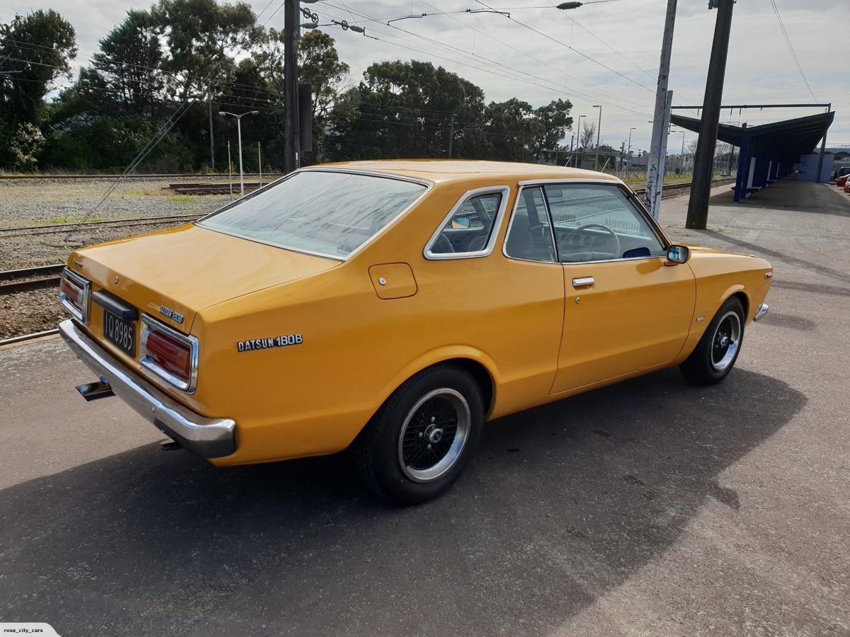 1977 Datsun 180B SSS coupie New Sealand orange original (1).jpg