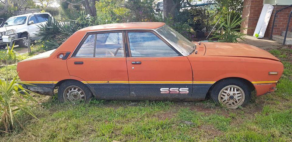 1981 Datsun Stanza SSS sedan red on black 2021 parts car wreck (1).jpg