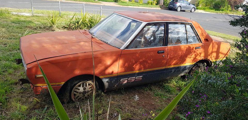 1981 Datsun Stanza SSS sedan red on black 2021 parts car wreck (2).jpg