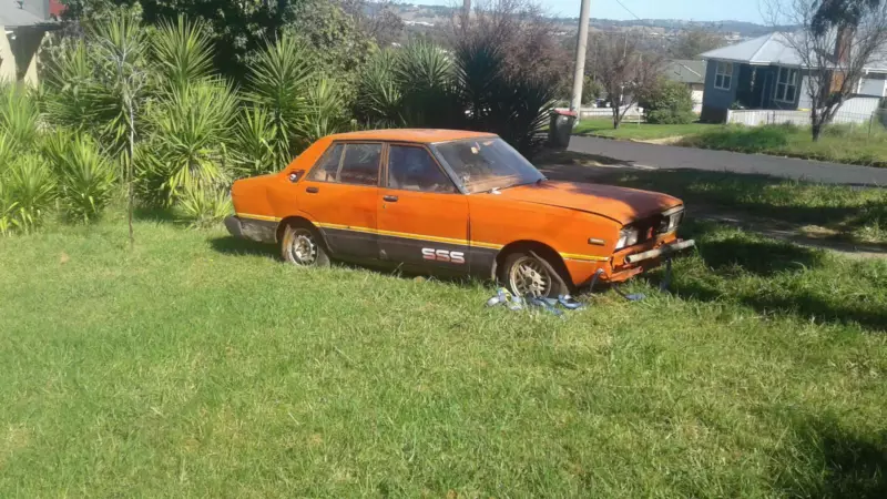 1982 Datsun Stanza SSS sedan red unrestored rusty NSW 2021 (1).png