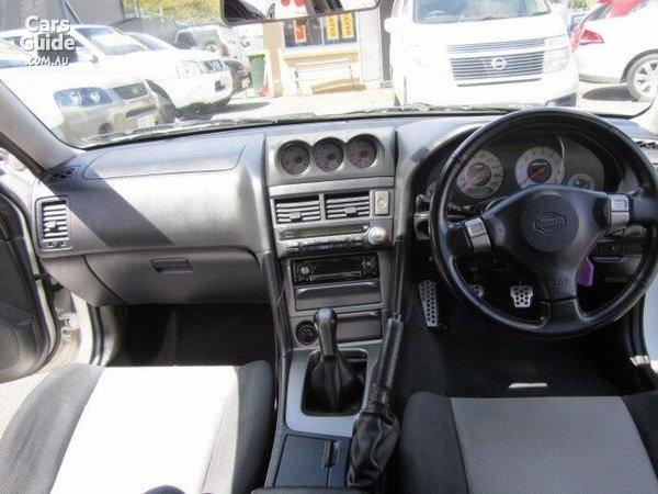 4 door R34 GT-T white Front dashboard.jpg