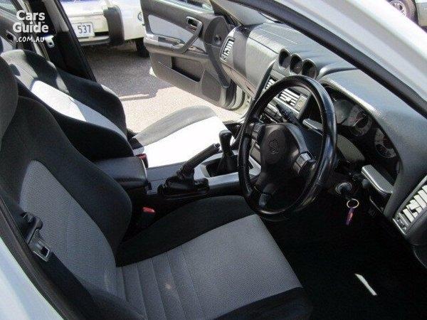 4 door R34 GT-T white Front seats and steering wheel.jpg