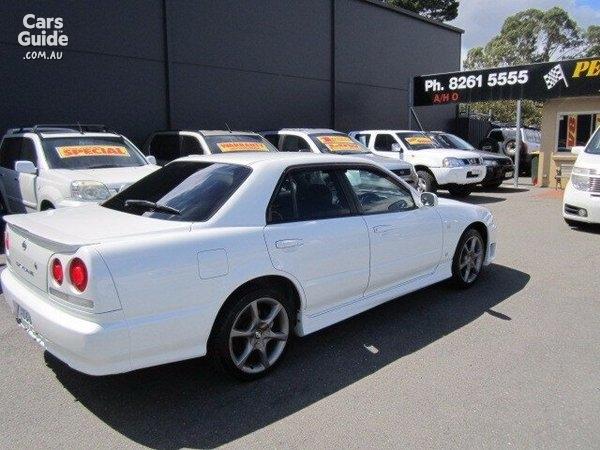 4 door R34 GT-T white Rear shot.jpg