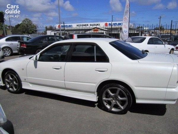 4 door R34 GT-T white Side profile.jpg