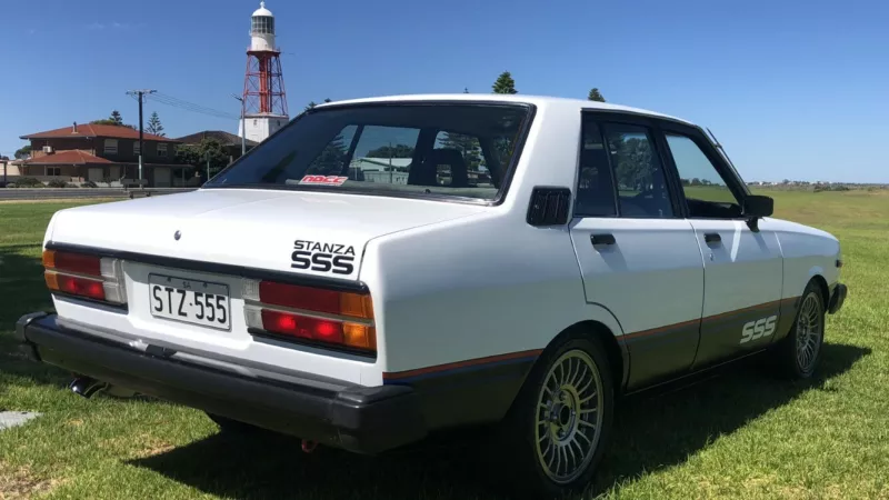 Datsun Stanza SSS Sedan white on black Australia 2021 (10).png