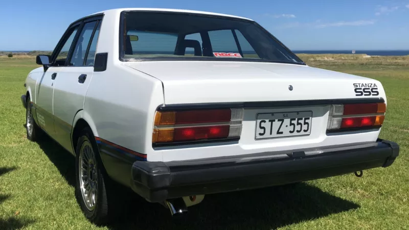 Datsun Stanza SSS Sedan white on black Australia 2021 (4).png