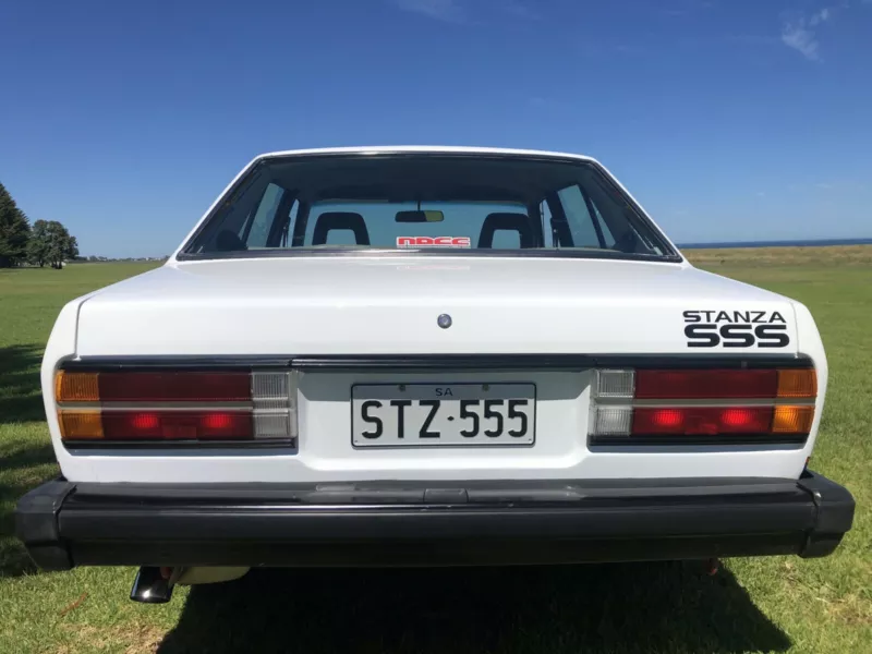 Datsun Stanza SSS Sedan white on black Australia 2021 (6).png