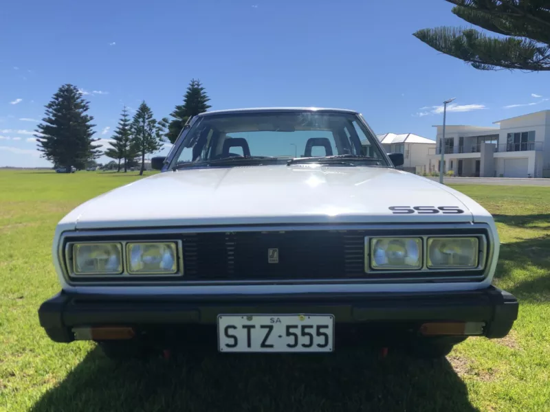 Datsun Stanza SSS Sedan white on black Australia 2021 (8).png