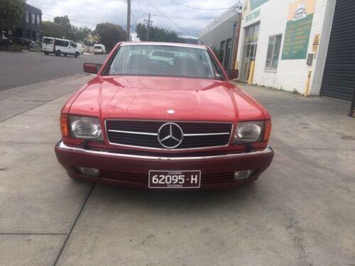 Mercedes 560SEC C126 classic Signal red over burgundy images (1).jpg