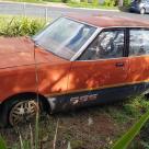 1981 Datsun Stanza SSS sedan red on black 2021 parts car wreck (2).jpg