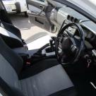 4 door R34 GT-T white Front seats and steering wheel.jpg