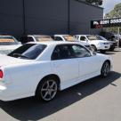 4 door R34 GT-T white Rear shot.jpg