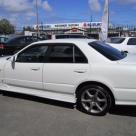 4 door R34 GT-T white Side profile.jpg