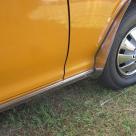 Burnt Orange Datsun 180B Sedan unrestored original Australia (11) hubcaps.jpg