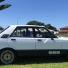 Datsun Stanza SSS Sedan white on black Australia 2021 (1).png