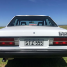 Datsun Stanza SSS Sedan white on black Australia 2021 (6).png