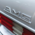 Mercedes 560 SEC 6.0 AMG Widebody Silver amg badge.png