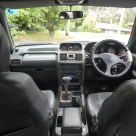 Pajero SWB 1996 NJ leather seats and woodgrain interior images (1).png